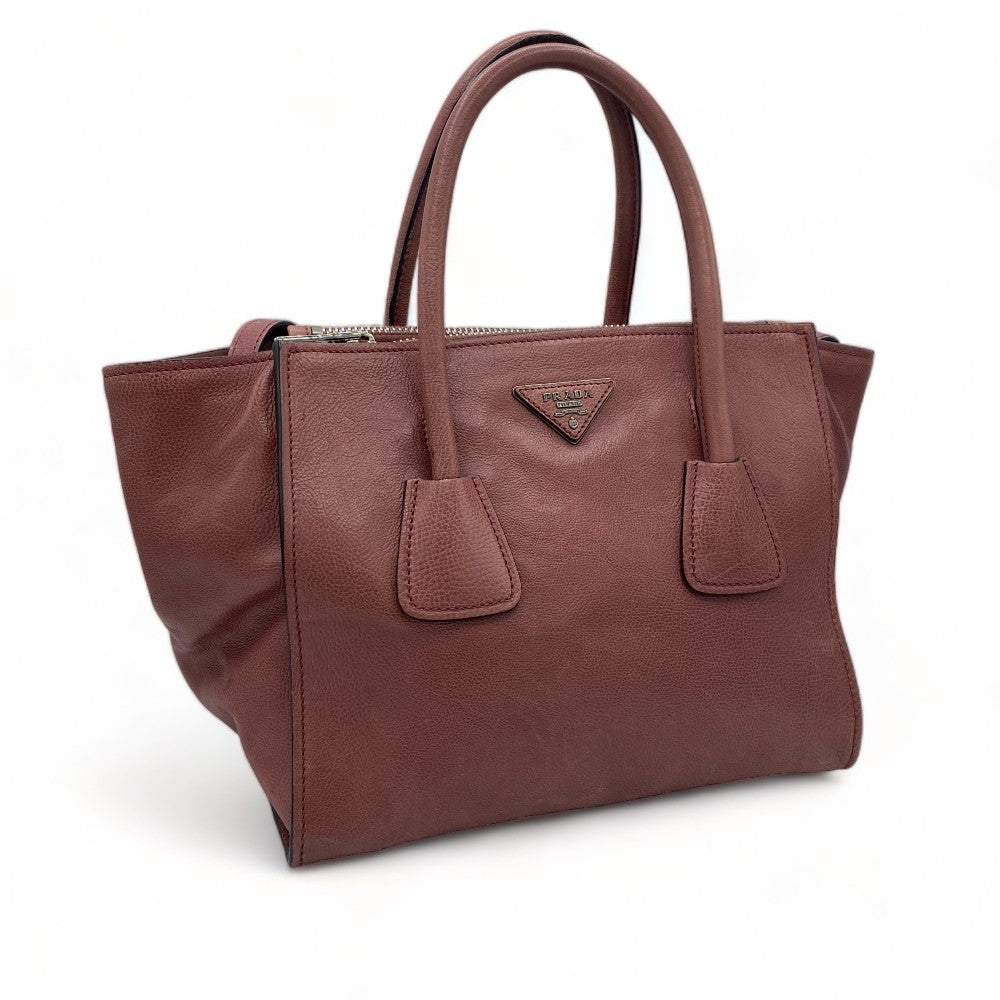 Prada handbag 2way made of Saffiano leather with shoulder strap in dark pink