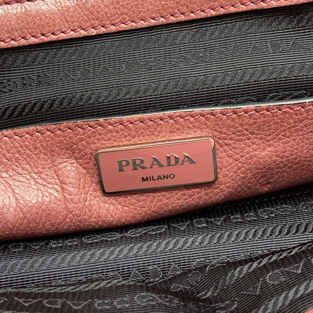 Prada handbag 2way made of Saffiano leather with shoulder strap in dark pink