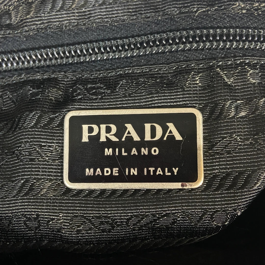 Prada handbag with adjustable nylon shoulder strap in black